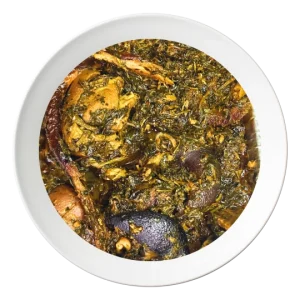A plate of Afang soup, a traditional Nigerian vegetable soup with assorted meats, available for order in Bolingbrook, Illinois."