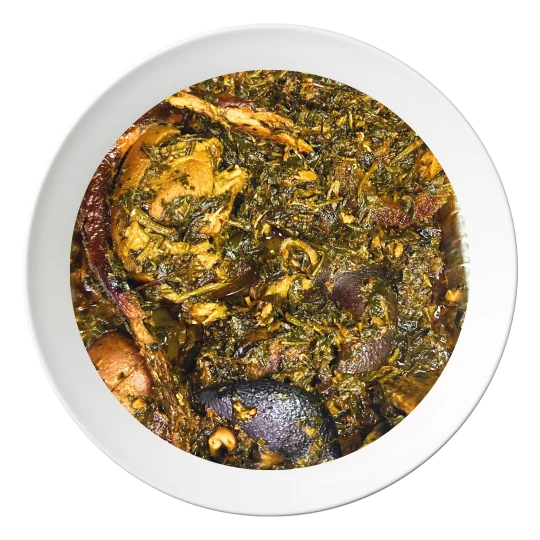 A plate of Afang soup, a traditional Nigerian vegetable soup with assorted meats, available for order in Bolingbrook, Illinois."