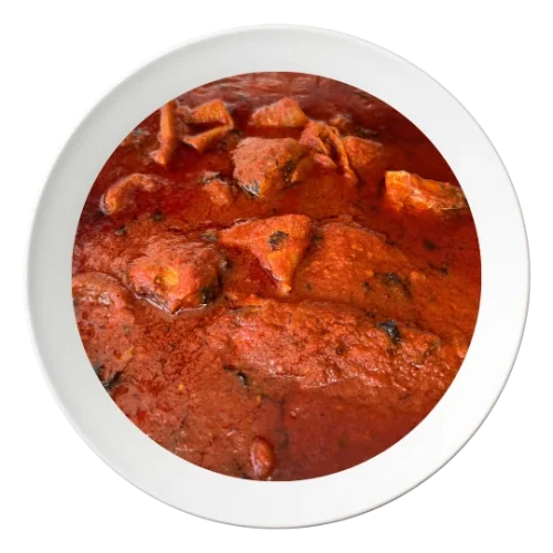 A bowl of stew with assorted meat, a rich Nigerian stew, available for delivery in Bolingbrook, Illinois.