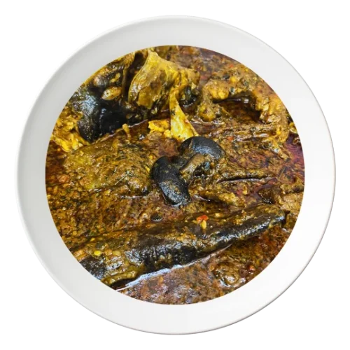 A bowl of Banga soup, a Nigerian palm nut soup with catfish, available for takeout in Bolingbrook, Illinois