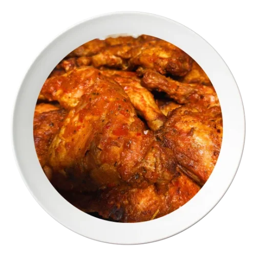 A plate of chicken lap, seasoned and cooked Nigerian style, available in Bolingbrook, Illinois.