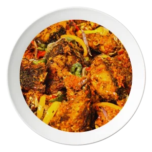 A plate of sautéed croaker fish, with vegetables and Nigerian spices, available in Bolingbrook, Illinois.