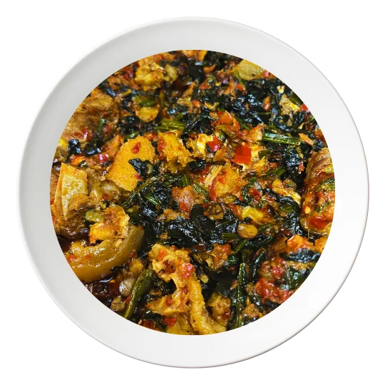 A bowl of Efo Riro, a Nigerian spinach stew with assorted meats, available for delivery in Bolingbrook, Illinois.