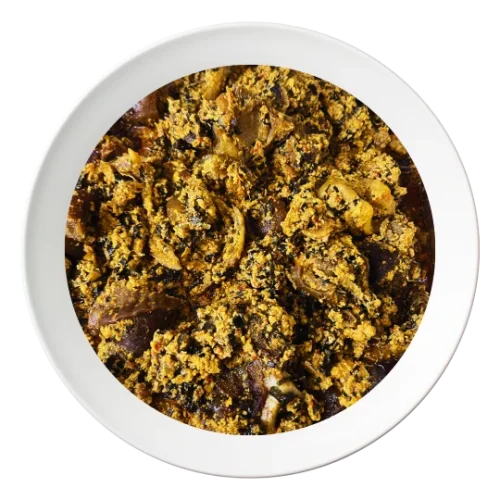 A plate of Egusi soup with spinach, vegetables, and oziza leaf, a flavorful Nigerian dish, order in Bolingbrook, Illinois