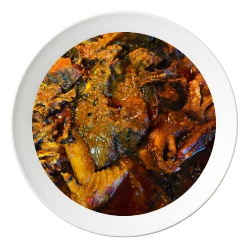A bowl of Ofe Akwa, a Nigerian palm nut stew with chicken, available in Bolingbrook, Illinois