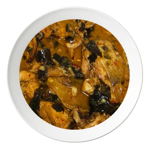 A serving of Ofe Nsala soup, a spicy Nigerian white pepper soup with catfish, available in Bolingbrook, Illinois.