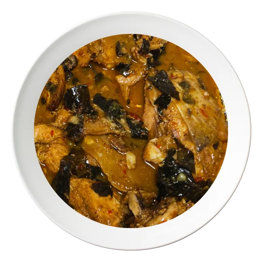 A serving of Ofe Nsala soup, a spicy Nigerian white pepper soup with catfish, available in Bolingbrook, Illinois.