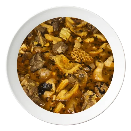 A bowl of Nigerian pepper soup, with goat meat, a spicy Nigerian soup, served in Bolingbrook, Illinois.