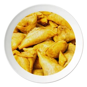 A plate of Samosas, Nigerian-style pastries filled with spiced meat, available in Bolingbrook, Illinois.