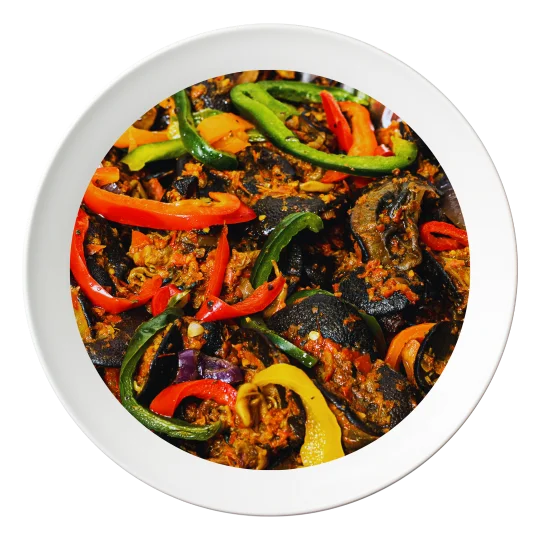 A plate of sautéed big size snail, with peppers and onions, order in Bolingbrook, Illinois.