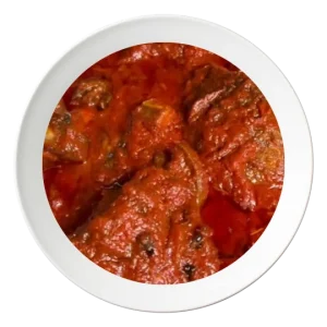 A plate of Stew with fried Tilapia fish, a Nigerian style dish, available in Bolingbrook, Illinois.